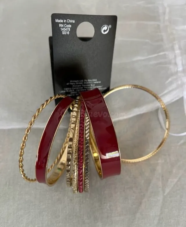 Set de pulseras doradas y rojas Primark - foto 4